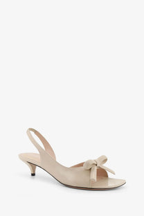 Beige patent leather slingback sandal with delicate bow at toe from dior women’s dior bow leather sandals beige collection