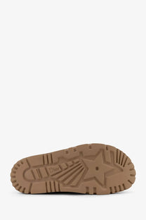 Tan rubber sole with embossed star and dior branding on dior women’s dior boy suede sabot beige