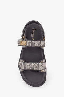 Black christian dior sandals with gray and white canvas monogram straps and gold-tone hardware Dioract flat sandals