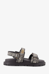 Black platform sandals with gray and white canvas fabric strap featuring dior logo in gold lettering