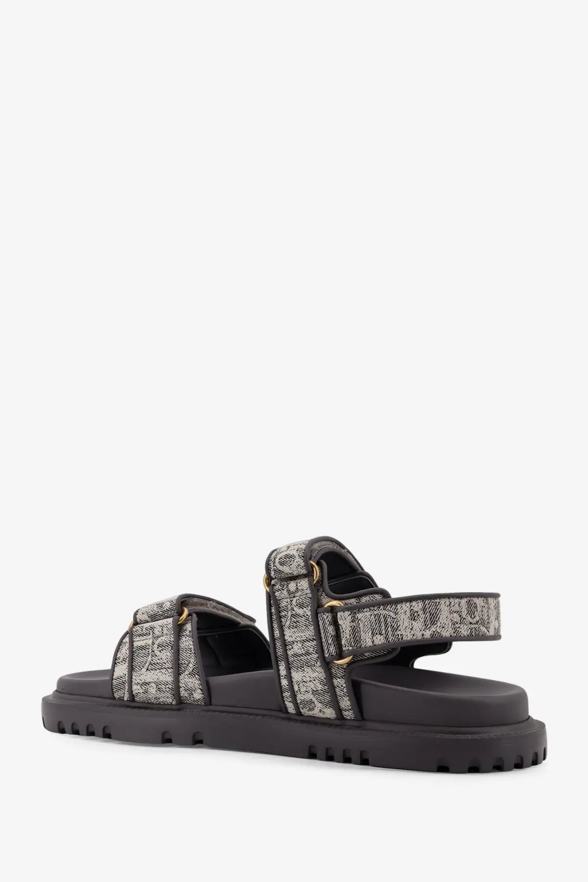 Black platform sandal by Dior with two adjustable textured straps and gold-tone hardware in canvas material