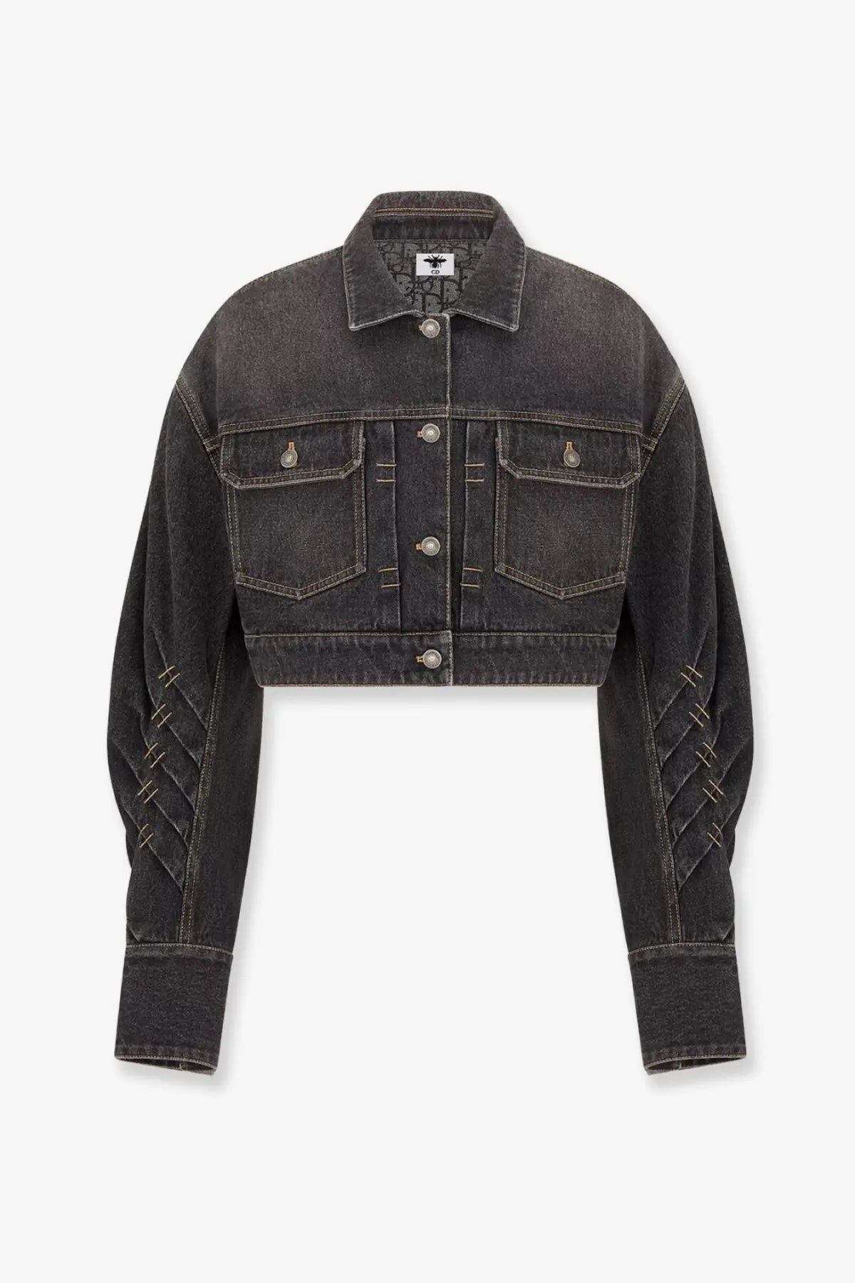 Dior women’s black denim jacket with silver buttons and distinctive diagonal stitching on the sleeves