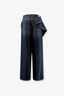 Back view of dior women’s dark indigo denim wide-leg jeans with draped flared detail in blue