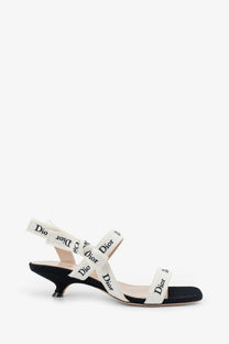 Black dior women’s embroidered canvas Jadior sandals with white straps featuring the brand’s logo pattern