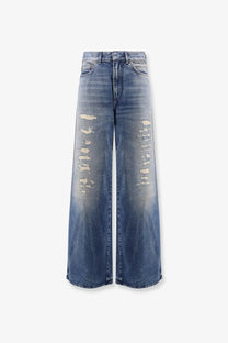 Dior women’s flared jeans blue made of blue denim with wide legs and distressed faded patches on the thighs