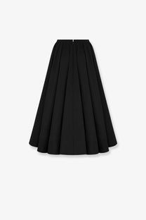 Back view of dior women’s black silk pleated midi skirt with smooth fabric and central zipper closure
