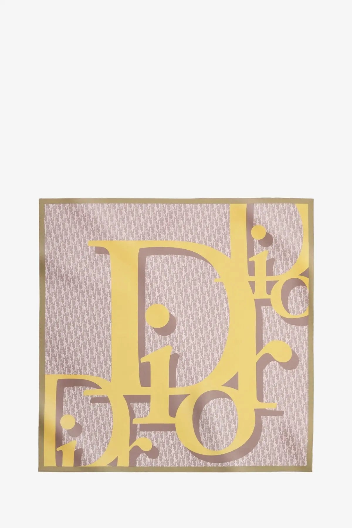 Dior women’s infini squared silk scarf pink with bold yellow dior logo on a subtle pink and beige textured background