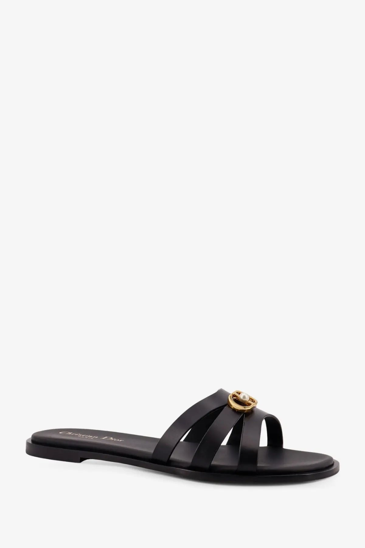 Black leather Dior slide sandal with gold-tone buckle featuring a pearl accent for women