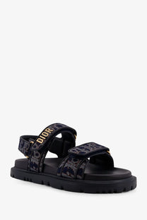 Black dior sandals with textured pattern and gold-tone branding on straps for womens dior oblique denim dioract sandals blue
