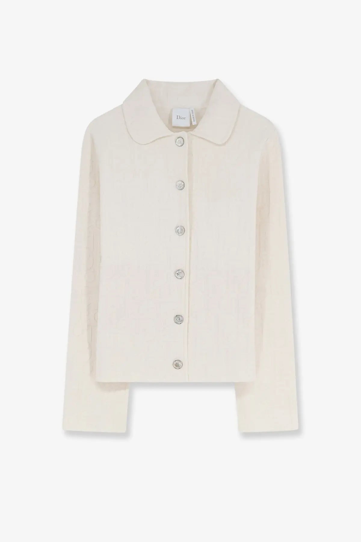 Cream-colored dior knit cardigan with classic collar and silver buttons paired with white dior oblique fabric blazer
