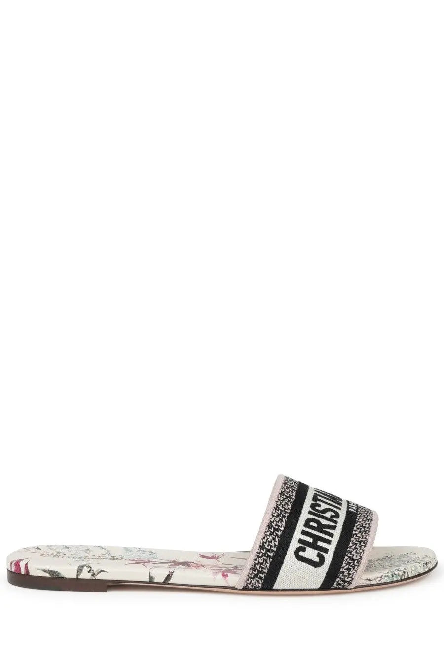 White christian dior slide sandal with black and white striped strap featuring bold dior branding