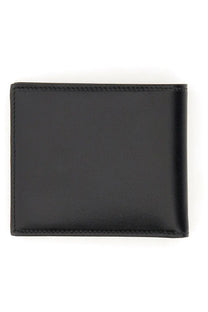 Dolce &amp; Gabbana men’s bifold wallet black leather with precise stitching along the edges visible on the back side