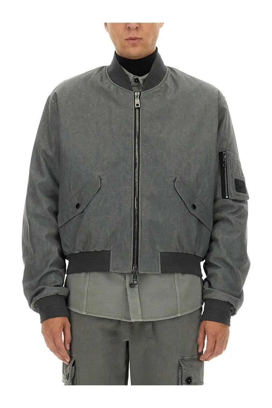 Dolce and gabbana men’s gray bomber jacket with black trim and zipper details over grey background