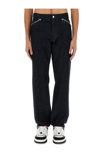 Dolce &amp; Gabbana men’s black denim jeans with white side stitching and button closure in Cimosed style