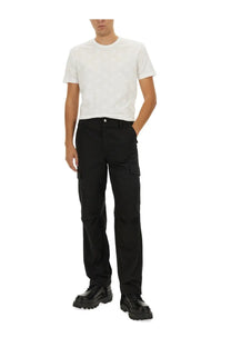 Black cargo pants with multiple pockets and straight-leg cut paired with dolce and gabbana men’s white cotton shirt