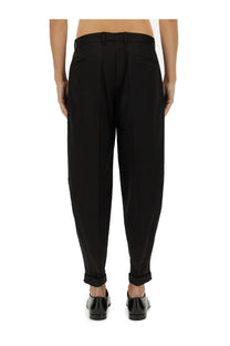 Dolce &amp; Gabbana men’s black tapered trousers with sleek modern cut and subtle pleats at the waist