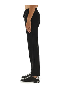 Dolce &amp; Gabbana men’s jogging pants black with a sleek straight-leg cut and subtle side seam detailing