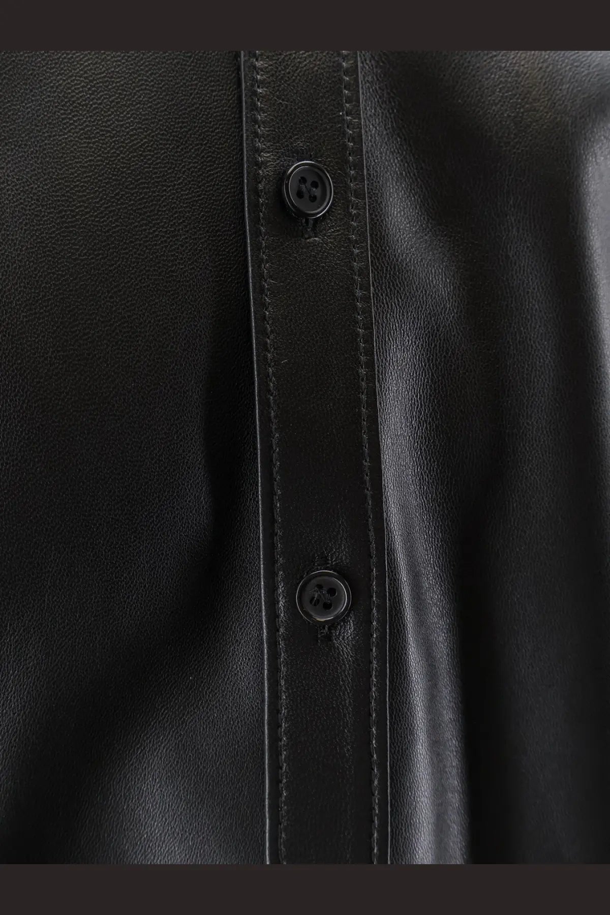 Dolce &amp; Gabbana men’s black leather button-up shirt jacket with subtle stitching along the front placket