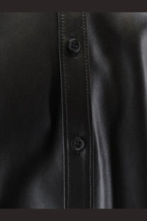 Dolce &amp; Gabbana men’s black leather button-up shirt jacket with subtle stitching along the front placket