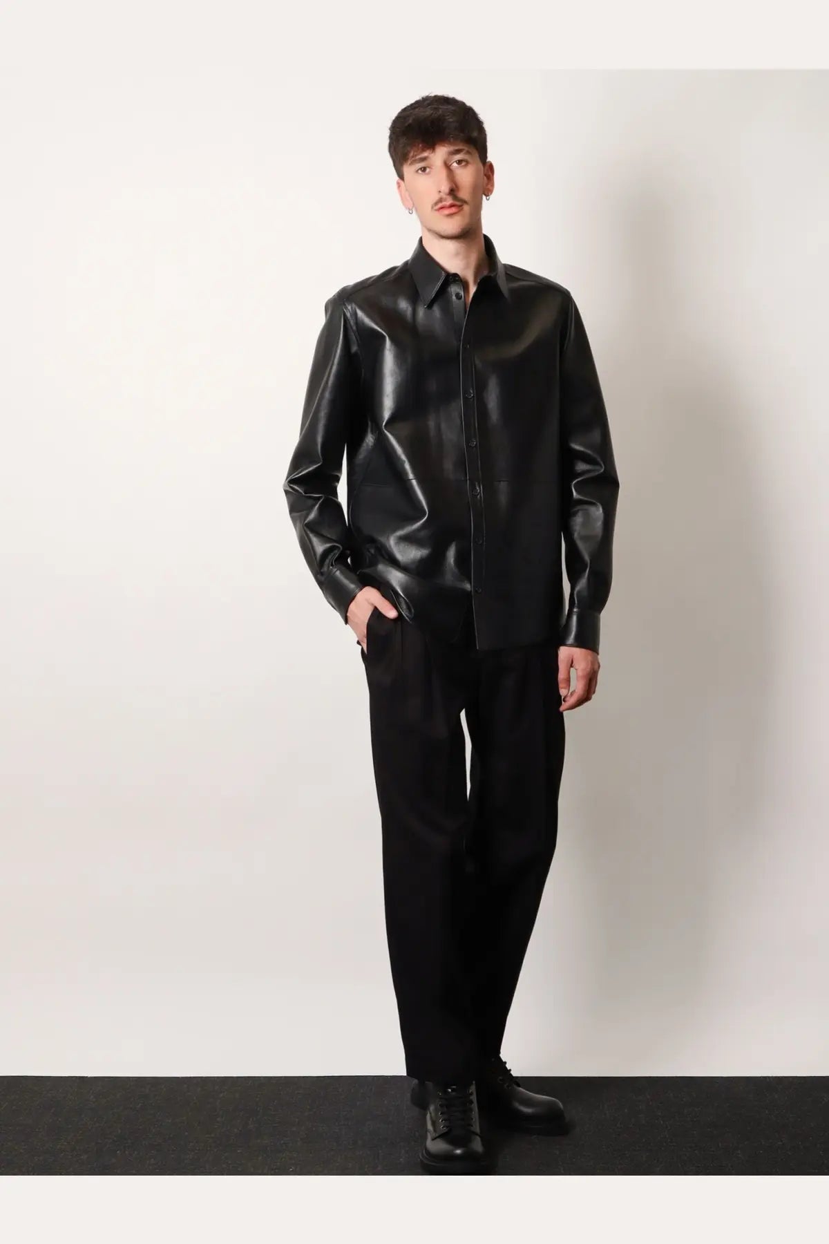 Dolce &amp; Gabbana men’s black faux leather shirt jacket with button-up front and sleek glossy finish