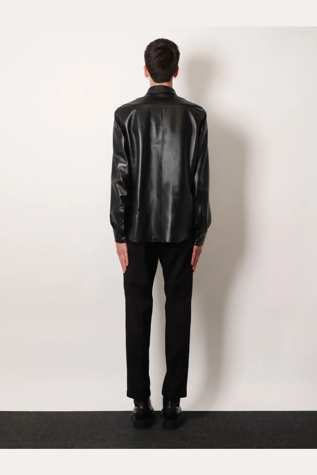 Dolce and Gabbana men’s black glossy faux leather shirt jacket with classic collar and long sleeves