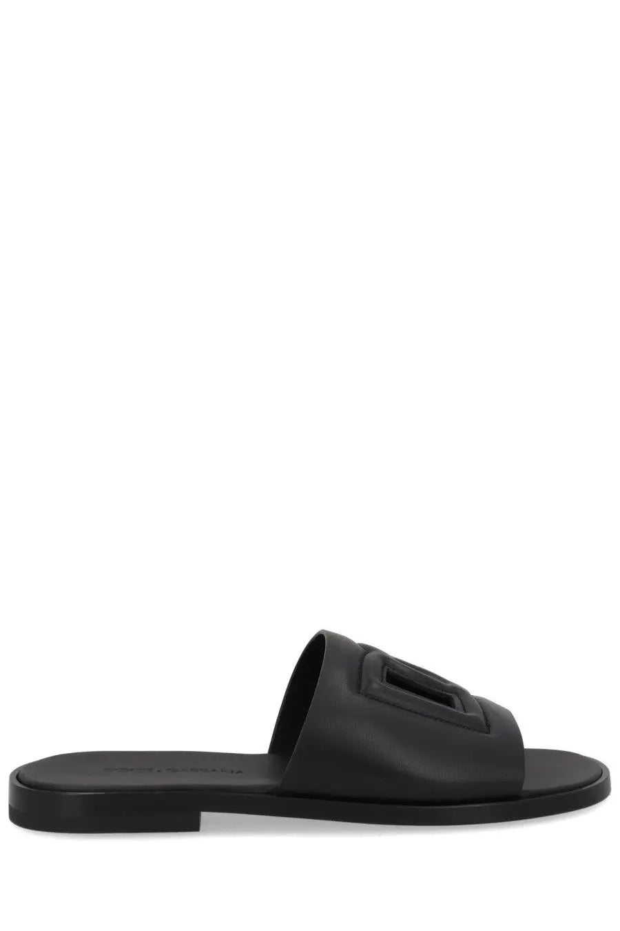 Dolce &amp; Gabbana men’s black leather slide sandal with bold embossed rectangular logo on the strap