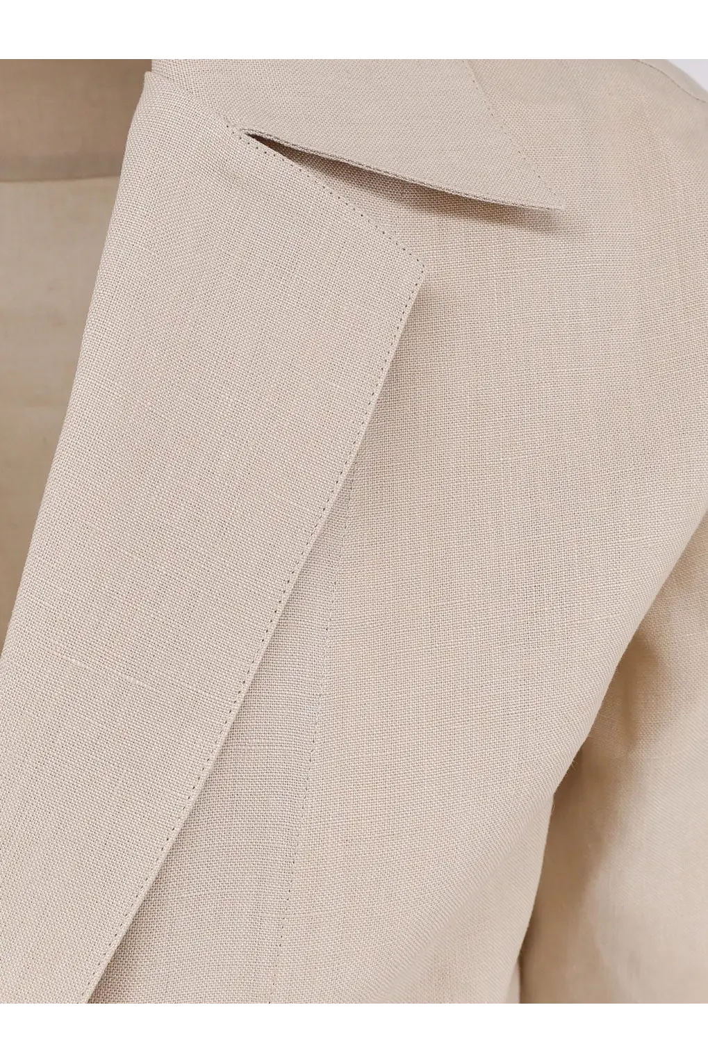 Beige linen blazer with subtle textured weave and clean stitching featured with Dolce and Gabbana men’s linen shirt red