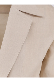 Beige linen blazer with subtle textured weave and clean stitching featured with Dolce and Gabbana men’s linen shirt red