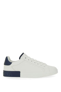 Dolce &amp; Gabbana men’s Portfino white leather low-top sneaker with navy blue heel tab and midsole branding