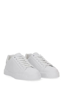 Dolce &amp; Gabbana men’s Portfino white leather low-top sneakers with clean minimalist design and subtle tongue branding