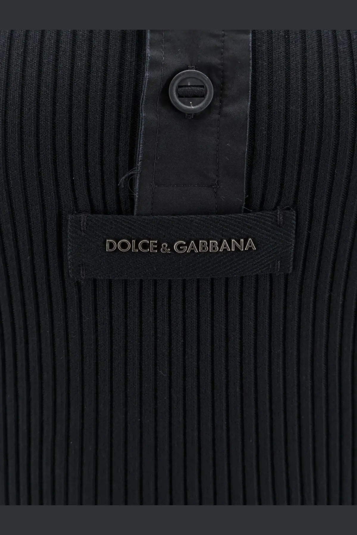 Dolce &amp; gabbana men’s black ribbed cotton sweater with sleek button closure and branded label visible