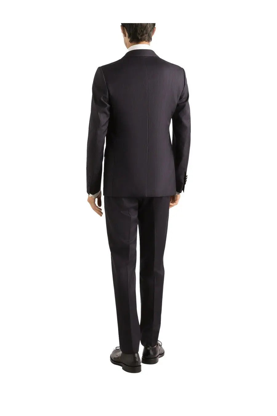 Black tailored suit with sleek structured fit and subtle sheen paired with dolce and gabbana men’s silk white shirt