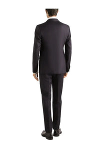 Black tailored suit with sleek structured fit and subtle sheen paired with dolce and gabbana men’s silk white shirt