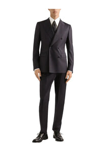 A sharply tailored navy blue double-breasted suit with classic fit and subtle texture paired with dolce gabbana men’s silk white shirt