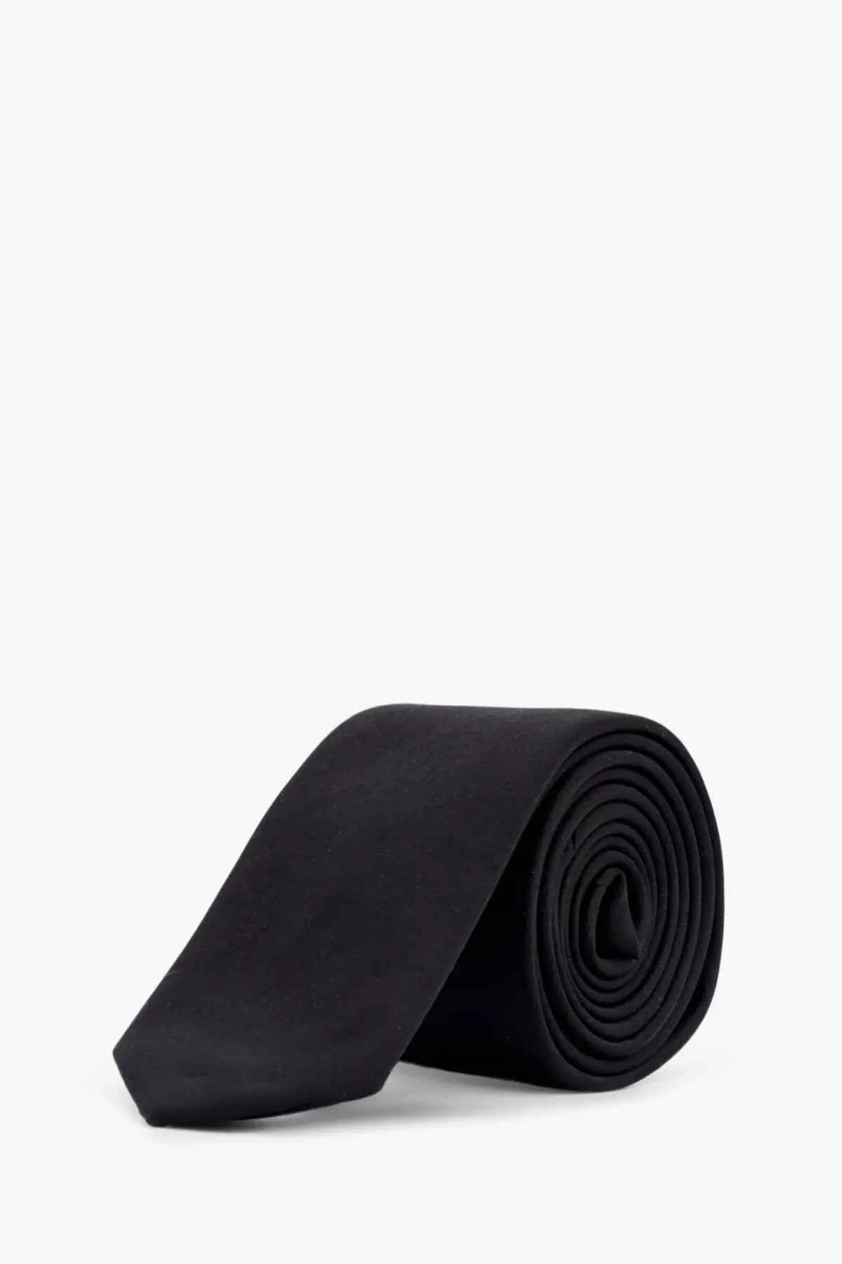 A sleek black silk tie by dolce and gabbana neatly rolled displayed against a clean white background