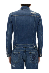 Dark blue dolce &amp; gabbana men’s stretch denim jacket showing distressed details and embroidered logo on back pocket