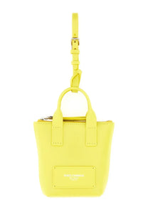 A vibrant yellow leather mini tote bag with top handle, detachable strap, and dolce &amp; gabbana logo plaque
