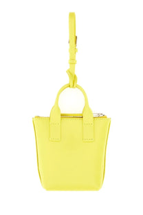 A vibrant yellow leather mini tote bag with top handle and detachable shoulder strap from Dolce and Gabbana