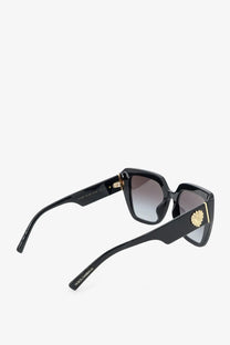 Dolce &amp; Gabbana women’s black acetate sunglasses with square frames gold-tone Medusa emblem and gradient gray lenses