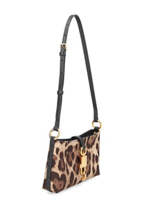 Dolce &amp; Gabbana women’s leopard print handbag with black leather strap and gold tone hardware lock pattern