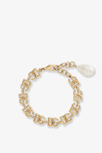 Dolce and Gabbana women’s gold brass bracelet with interlocking dg logos and a dangling white pearl charm