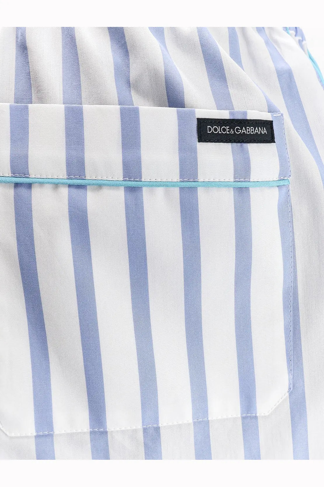 Dolce &amp; Gabbana women’s white and light blue striped cotton and silk shorts with a black brand label on the front pocket