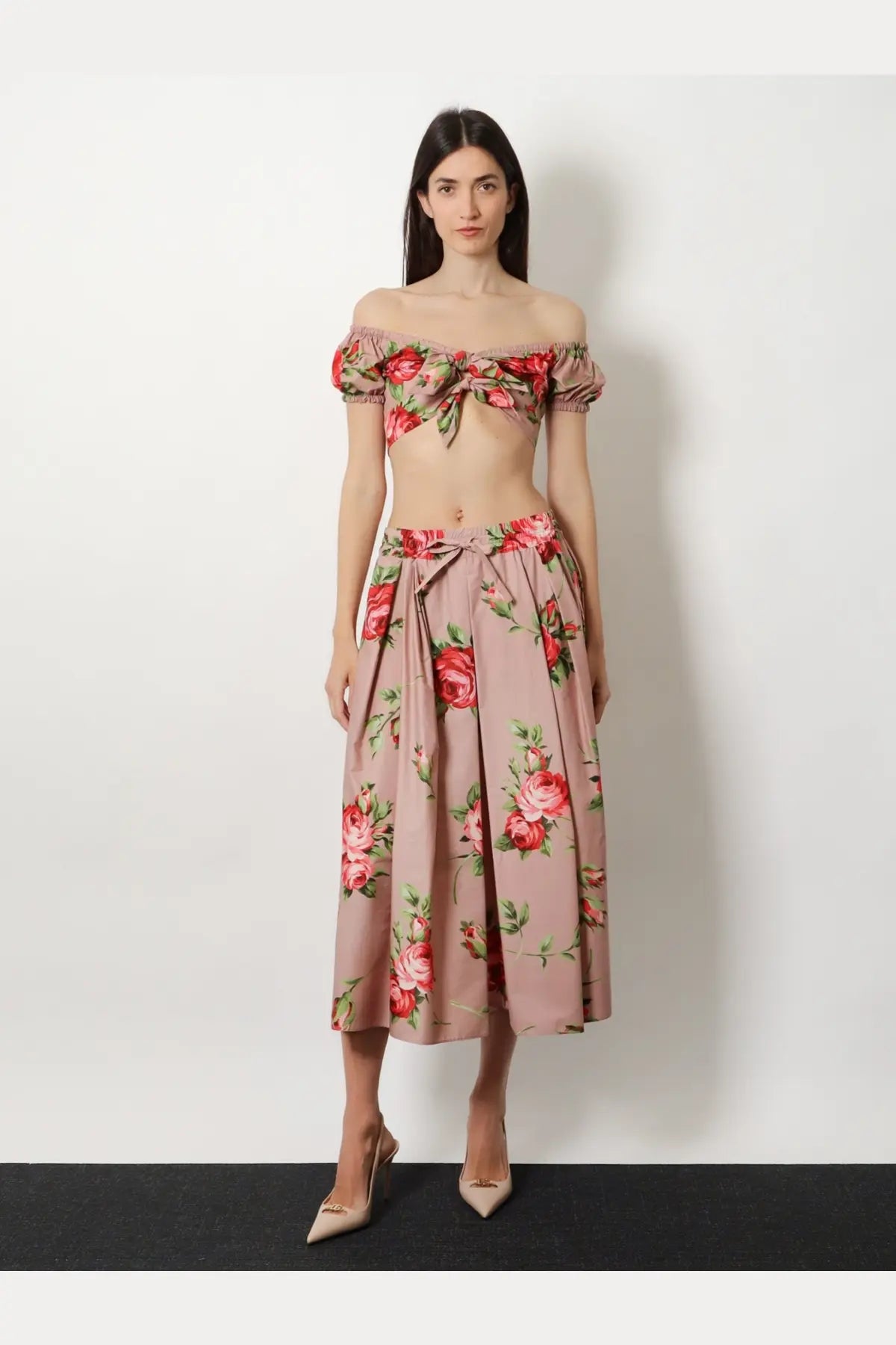 Dolce &amp; Gabbana women’s pink cotton skirt paired with a pink floral off-the-shoulder crop top with ruffled sleeves and tied waistband
