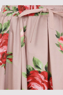 Dolce &amp; Gabbana women’s soft pink cotton skirt with vibrant red rose green leaf floral pattern and elastic waistband ties