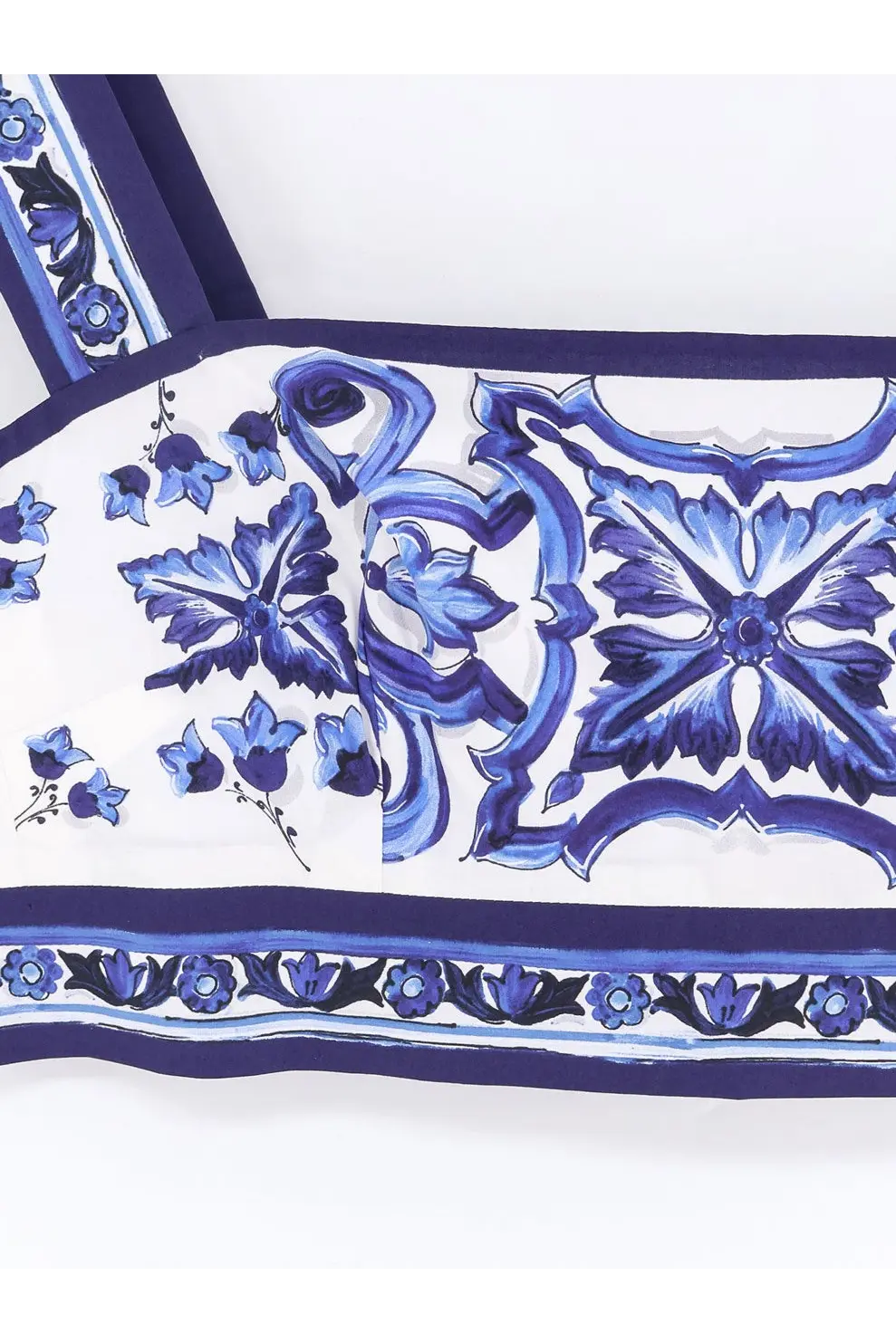 White silk scarf with intricate blue floral and ornamental patterns and bold navy border for Dolce &amp; Gabbana cotton top