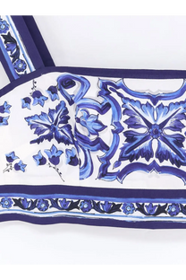 White silk scarf with intricate blue floral and ornamental patterns and bold navy border for Dolce &amp; Gabbana cotton top