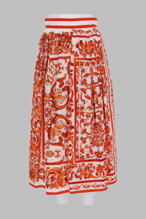 Dolce &amp; Gabbana women’s orange and white popeline pleated midi skirt with baroque pattern and bold red borders