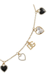 Dolce &amp; Gabbana women’s gold charm bracelet with heart pendants featuring black enamel crystals and dg logo pendant