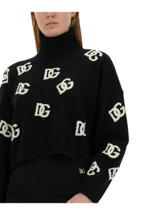Dolce &amp; Gabbana women’s black jersey cropped turtleneck sweater with white interlocking dg logo pattern