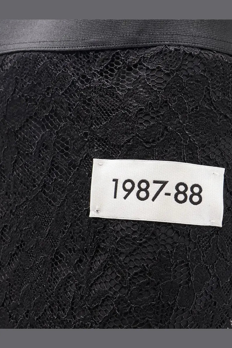 Dolce &amp; Gabbana women’s black lace midi skirt featuring a white label reading 1987-88 visible on the back side